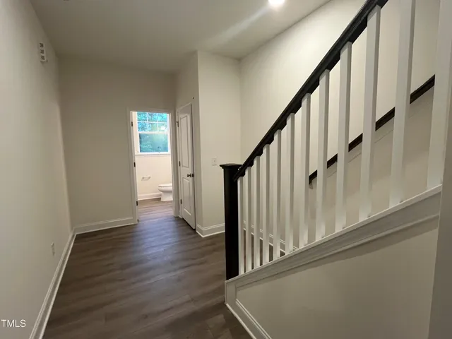 a bathroom with a toilet a sink and a mirror