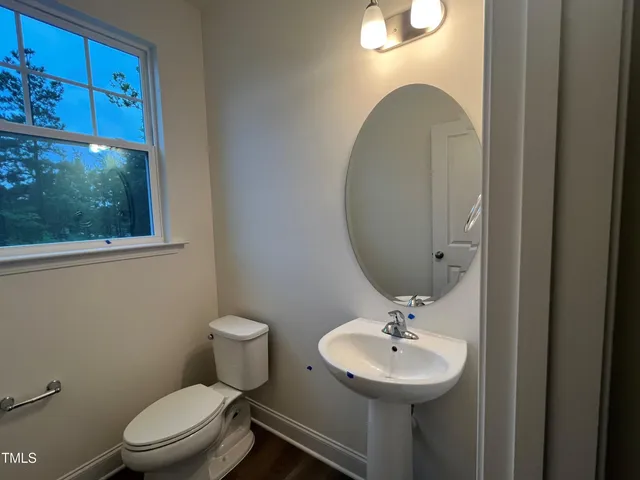 a view of staircase with wooden floor