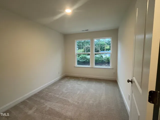 a view of sign board with yard