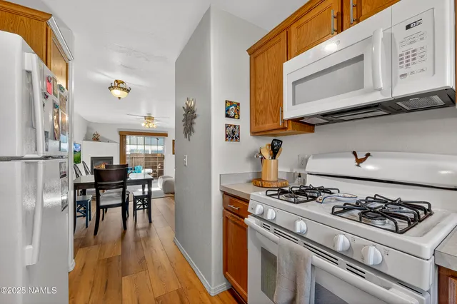 a kitchen with a stove a sink and a microwave