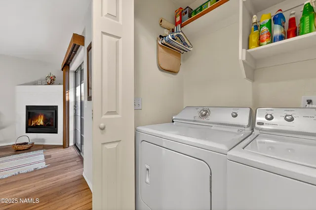 a view of storage and utility room with washer and dryer