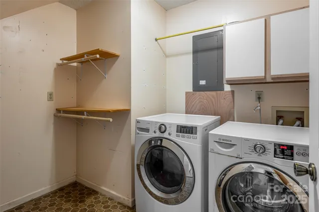 a view of storage and utility room with washer and dryer