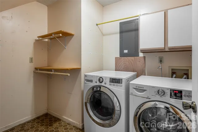 a view of storage and utility room with washer and dryer