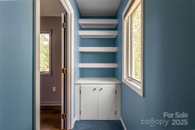 a view of front door with wooden floor