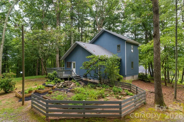 a wooden bench sitting in front of a house