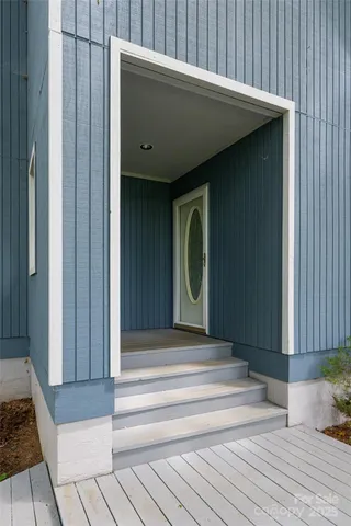 a view of entryway with a wooden door