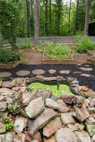a backyard of a house with a yard and outdoor seating