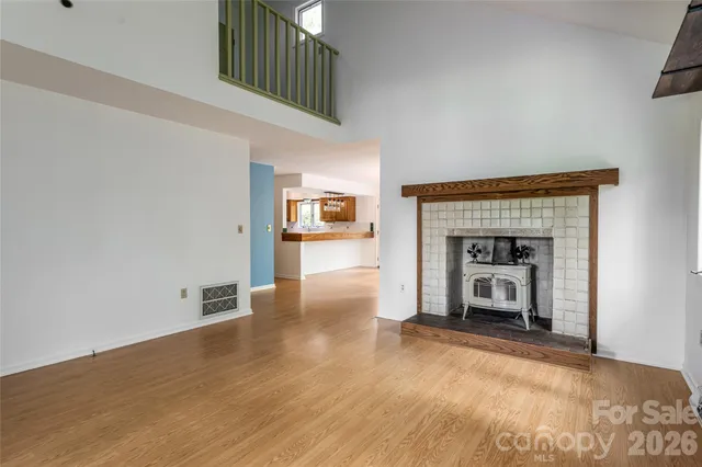 a view of empty room with a fireplace