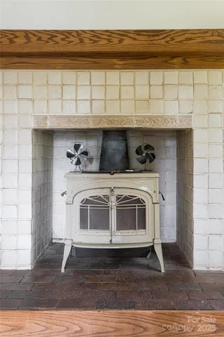 a stove top oven sitting inside of a kitchen