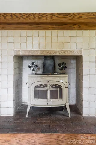 a stove top oven sitting inside of a kitchen