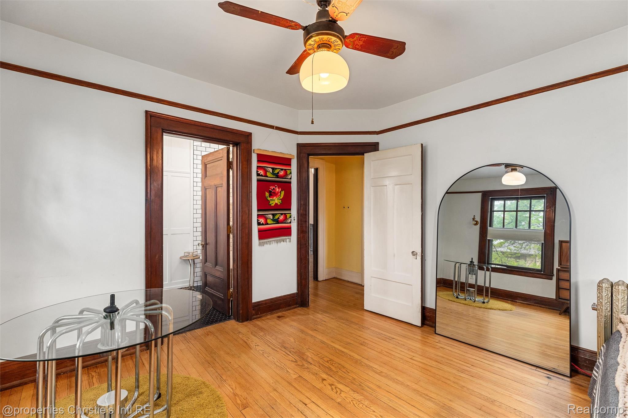 36 Longfellow Street Detroit, MI 48202 - Photo 47 of 81 Unfurnished bedroom with light wood-style floors, ceiling fan, and arched walkways