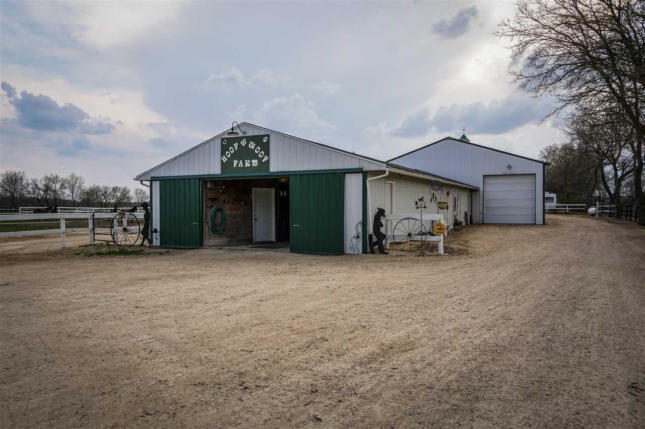 4545 River Road Cherry Valley, IL 61016 - Photo 24 of 25 a view of a house with a yard and garage