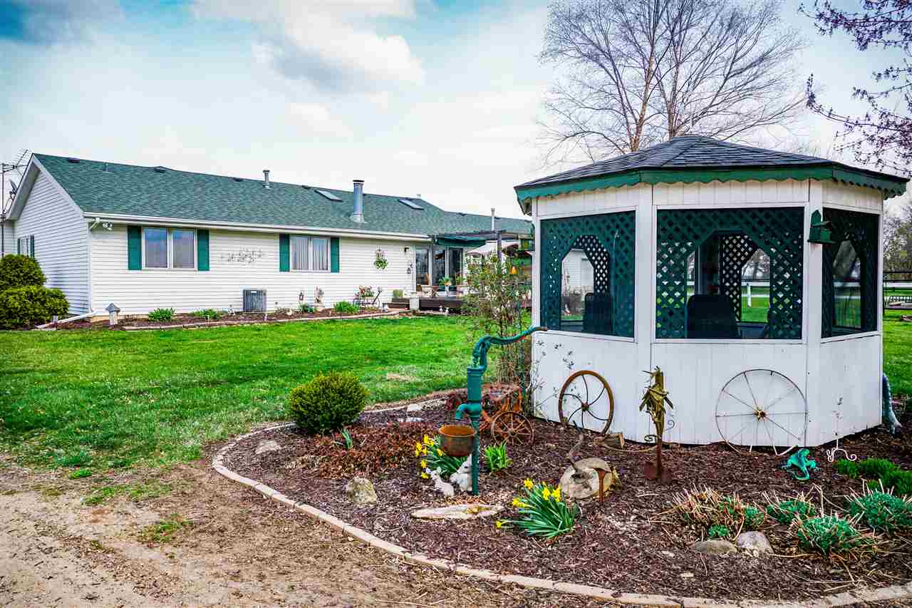 4545 River Road Cherry Valley, IL 61016 - Photo 25 of 25 a front view of a house with garden