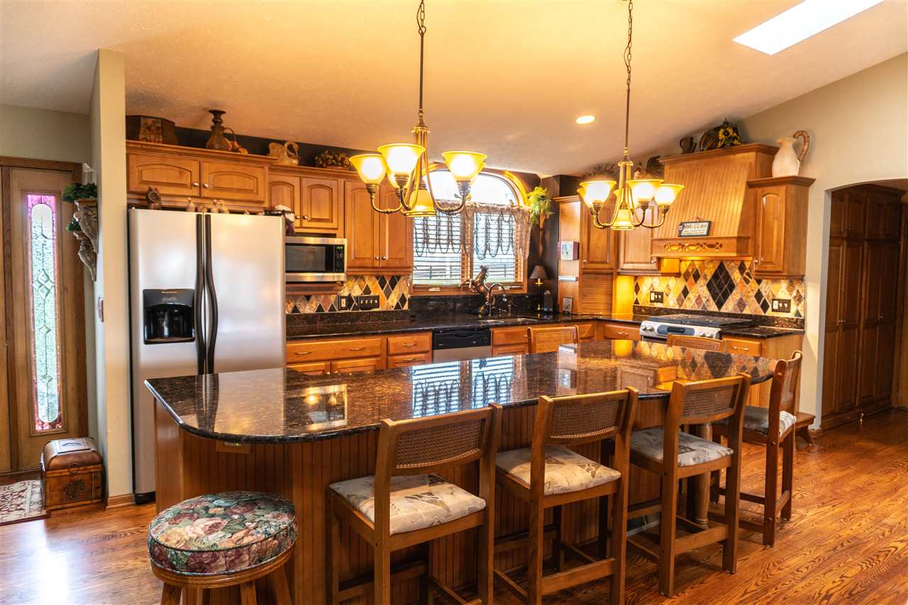 4545 River Road Cherry Valley, IL 61016 - Photo 6 of 25 a kitchen with a table and chairs