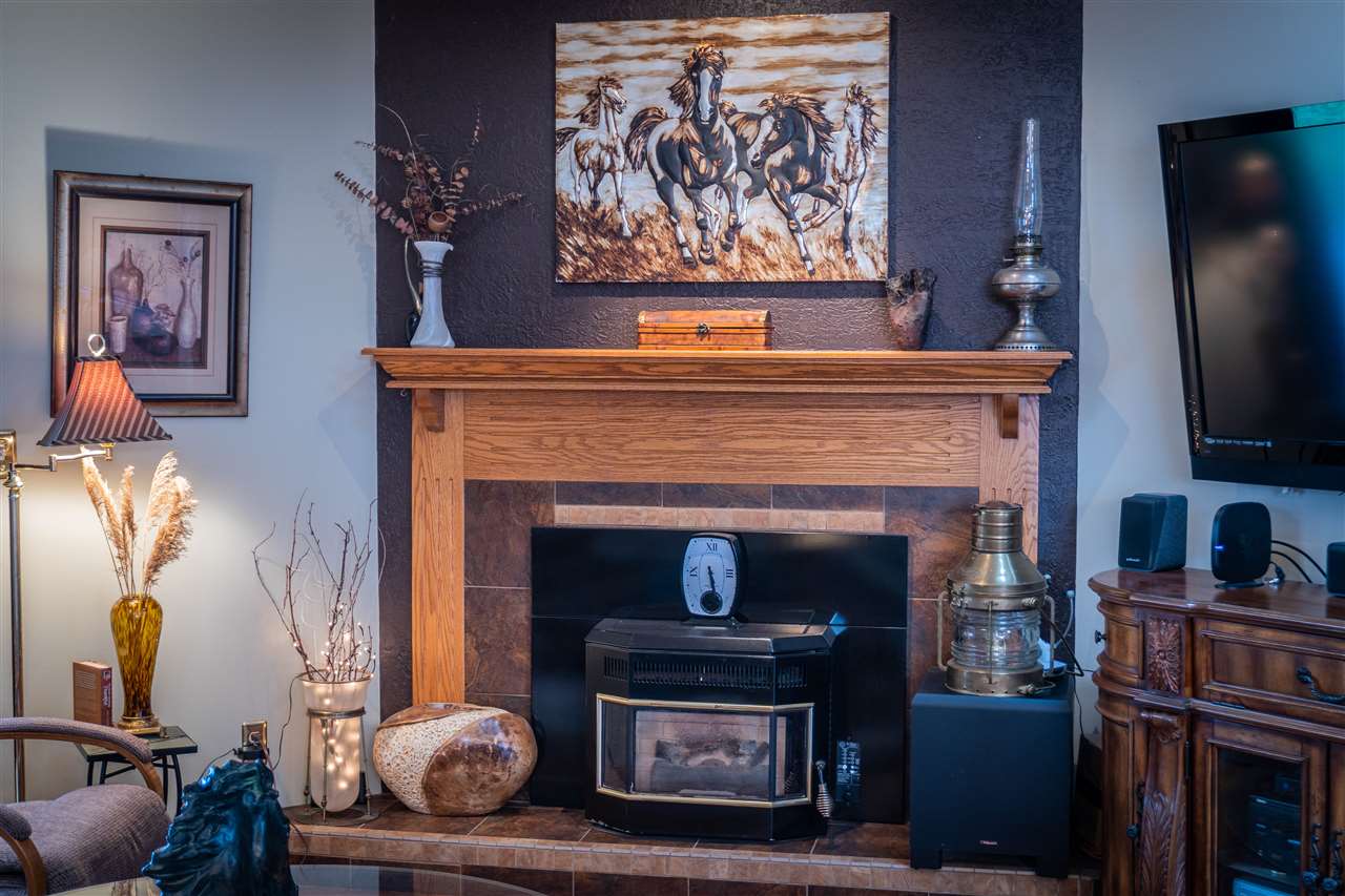4545 River Road Cherry Valley, IL 61016 - Photo 7 of 25 a living room with furniture and a fireplace