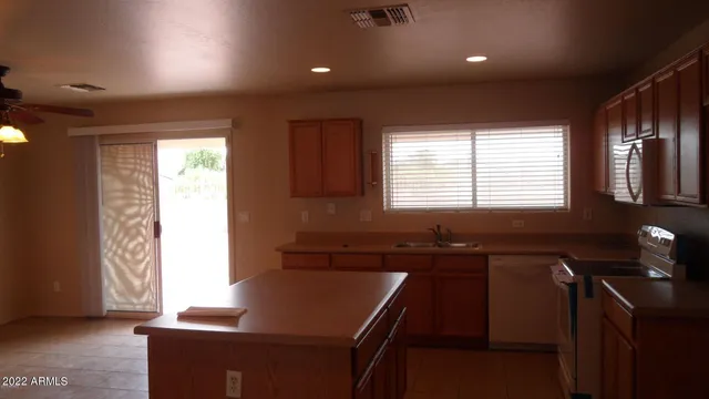 a kitchen with a sink and a window