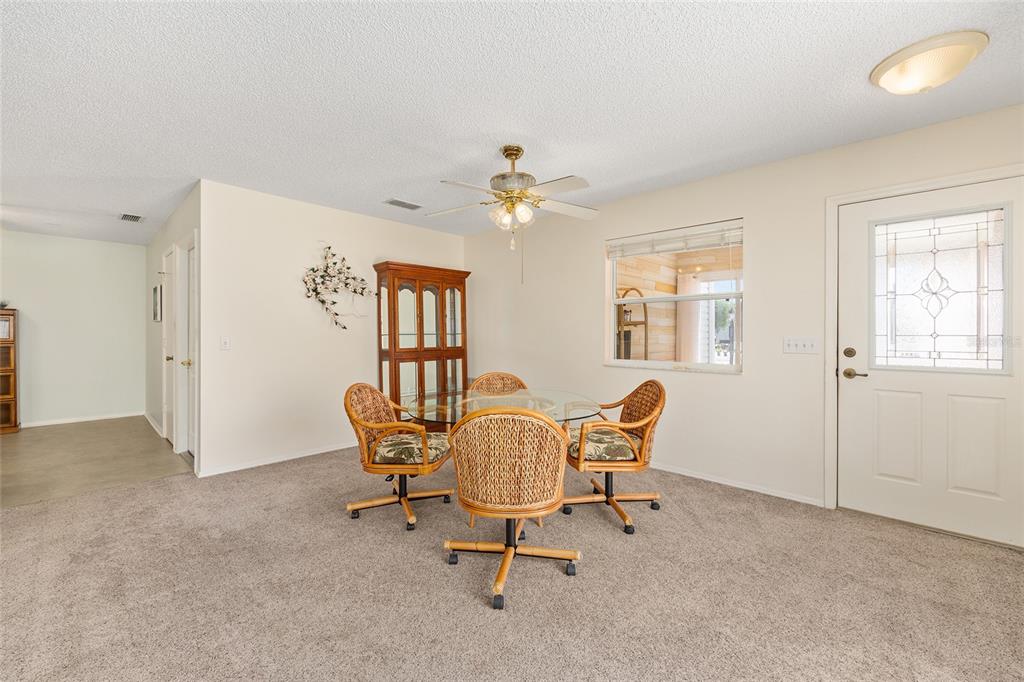 1710 Rosales Road The Villages, FL 32162 - Photo 4 of 23 a workspace room with furniture and windows