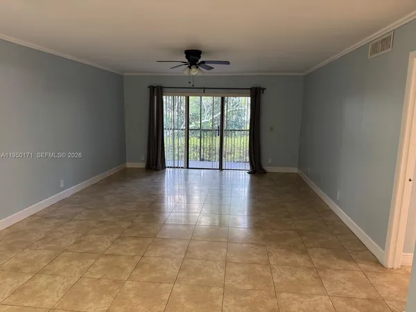 a view of an empty room with a window
