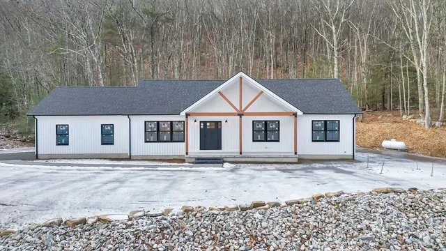 a house with trees in the background