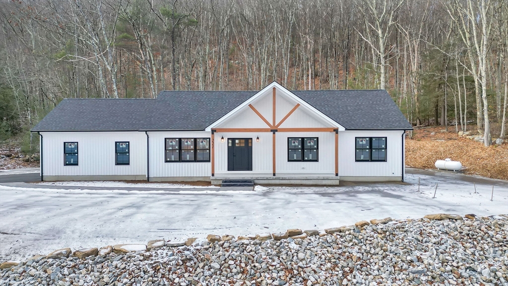 a house with trees in the background