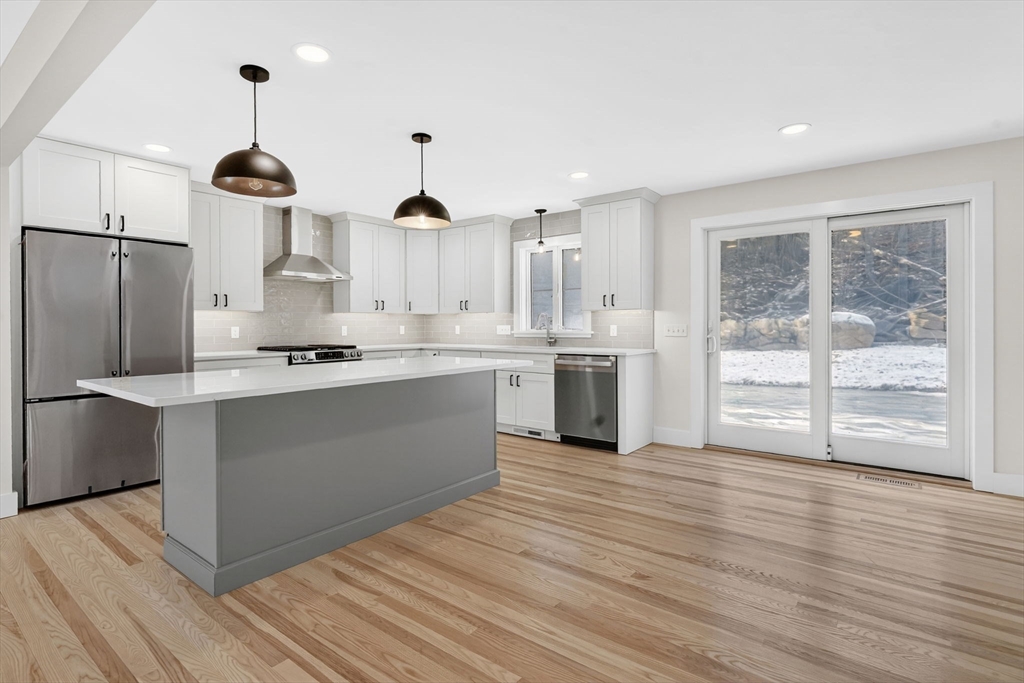 221 Cedar Swamp Road Monson, MA 01057 - Photo 13 of 37 a kitchen with stainless steel appliances granite countertop a stove a sink and a refrigerator