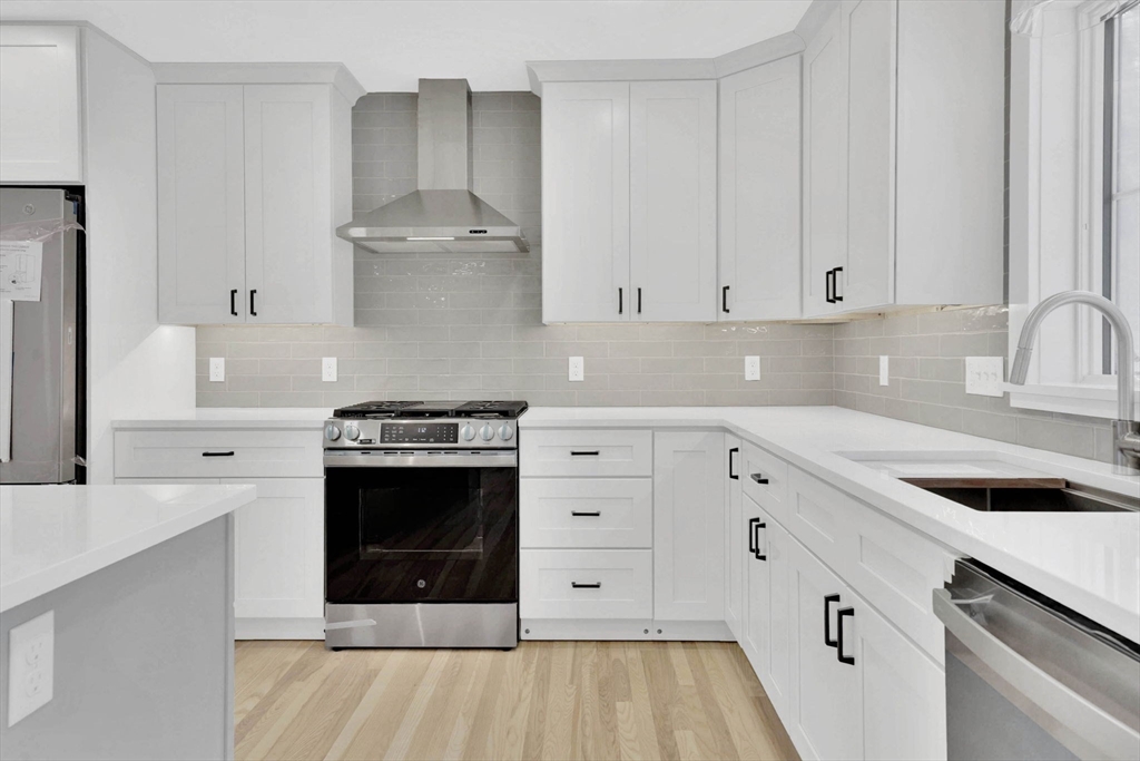 221 Cedar Swamp Road Monson, MA 01057 - Photo 16 of 37 a kitchen with cabinets appliances and a sink