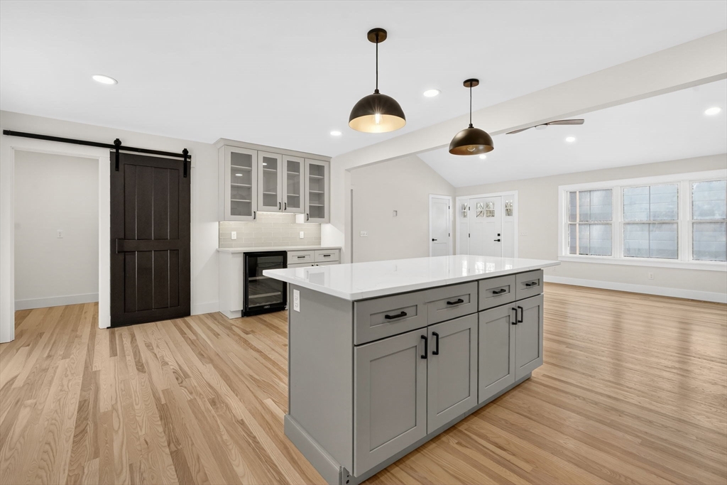 221 Cedar Swamp Road Monson, MA 01057 - Photo 18 of 37 a kitchen with stainless steel appliances granite countertop a stove and a wooden floors