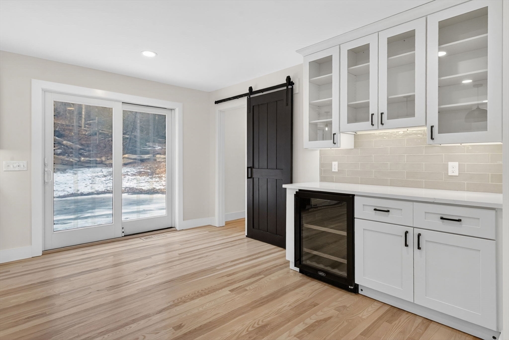 221 Cedar Swamp Road Monson, MA 01057 - Photo 19 of 37 a view of wooden floor and windows in a room