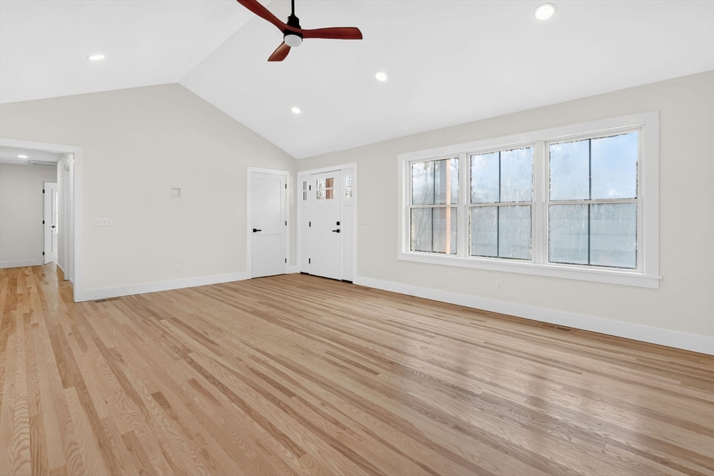 221 Cedar Swamp Road Monson, MA 01057 - Photo 21 of 37 a view of empty room with wooden floor and fan