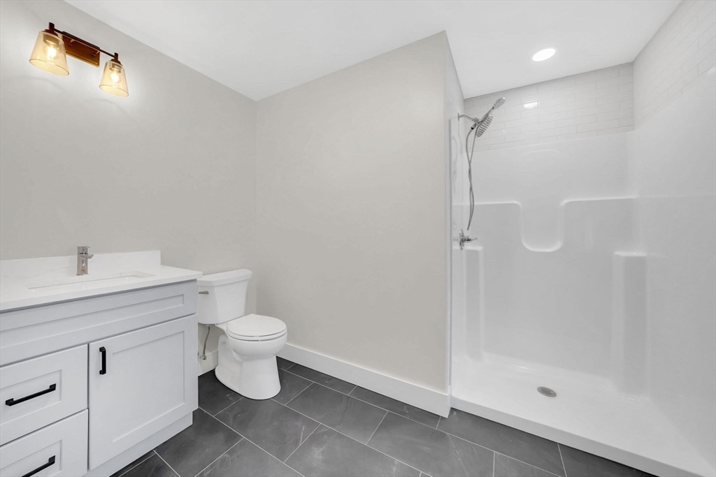 221 Cedar Swamp Road Monson, MA 01057 - Photo 25 of 37 a bathroom with a toilet sink and shower