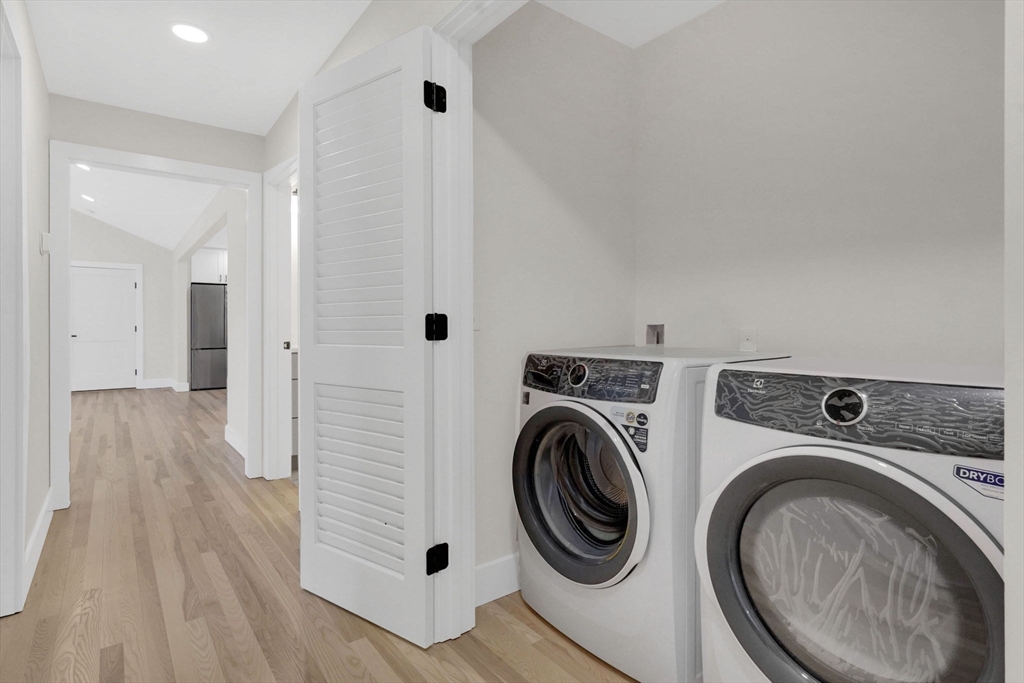 221 Cedar Swamp Road Monson, MA 01057 - Photo 29 of 37 a view of a hallway with washer and dryer