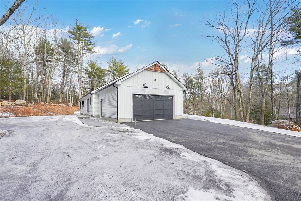 221 Cedar Swamp Road Monson, MA 01057 - Photo 33 of 37 a front view of a house with a yard and garage