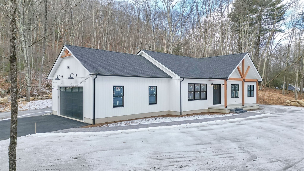 221 Cedar Swamp Road Monson, MA 01057 - Photo 5 of 37 a view of a house with a yard and garage