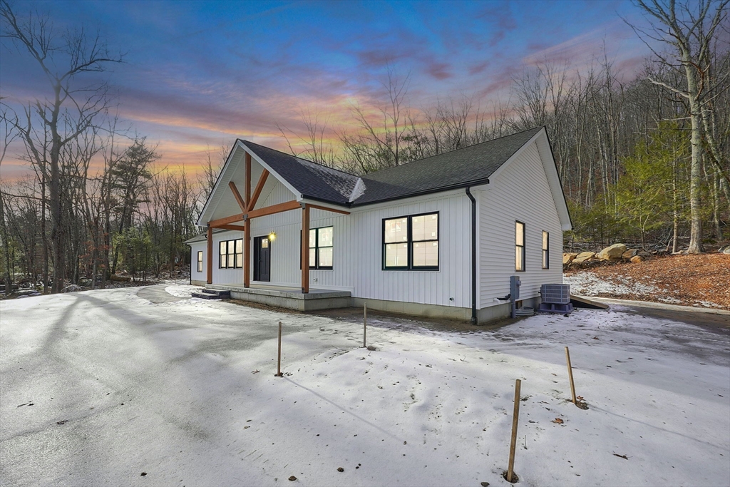 221 Cedar Swamp Road Monson, MA 01057 - Photo 6 of 37 a view of a house with a snow on the road
