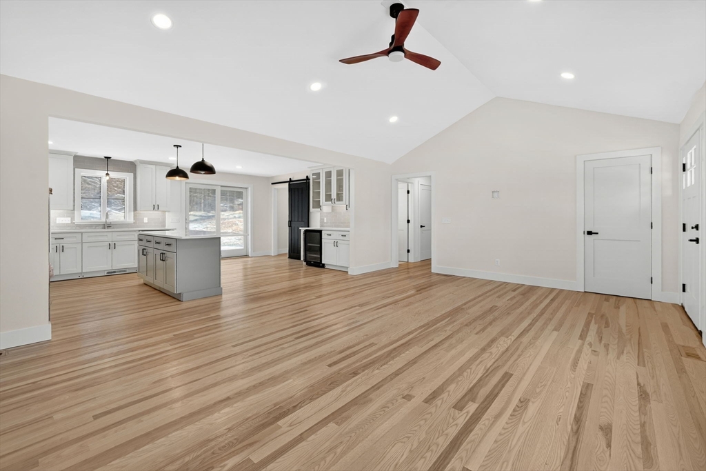 221 Cedar Swamp Road Monson, MA 01057 - Photo 9 of 37 a view of a kitchen with wooden floor and a sink
