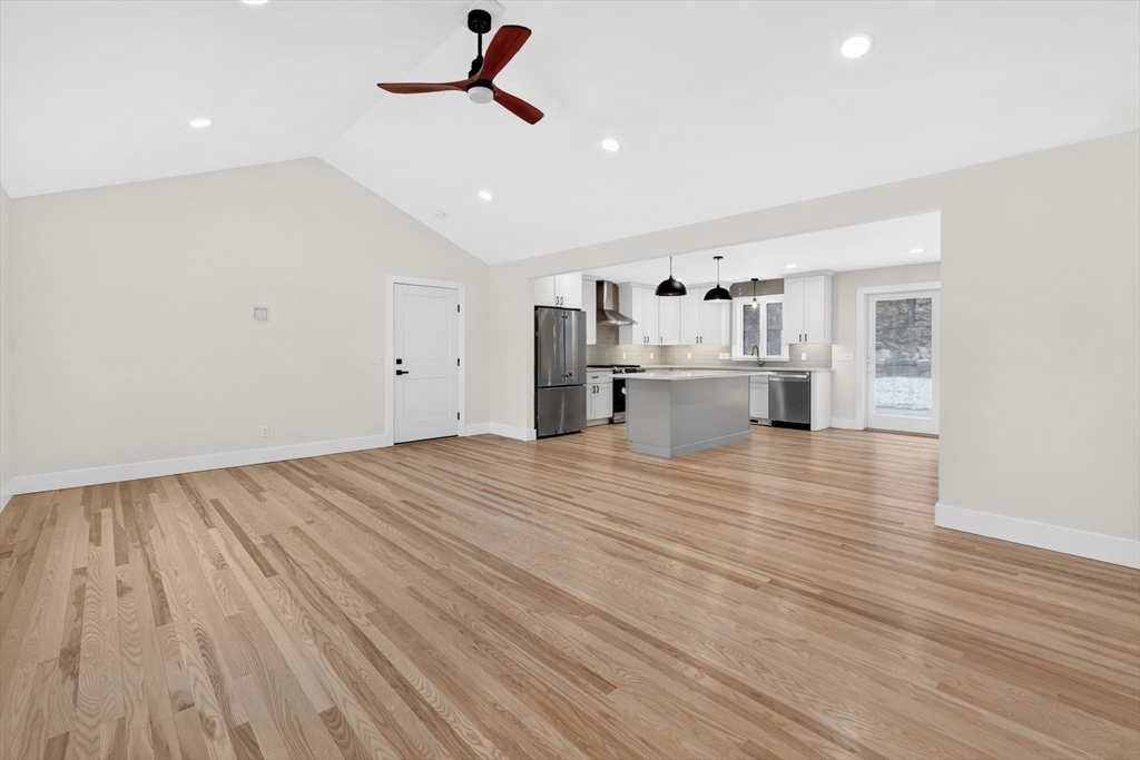 221 Cedar Swamp Road Monson, MA 01057 - Photo 10 of 37 a view of empty room with wooden floor and ceiling fan