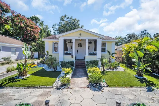 a view of house with garden and entertaining space