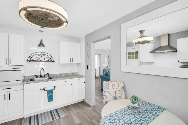 a spacious bathroom with a sink and a mirror