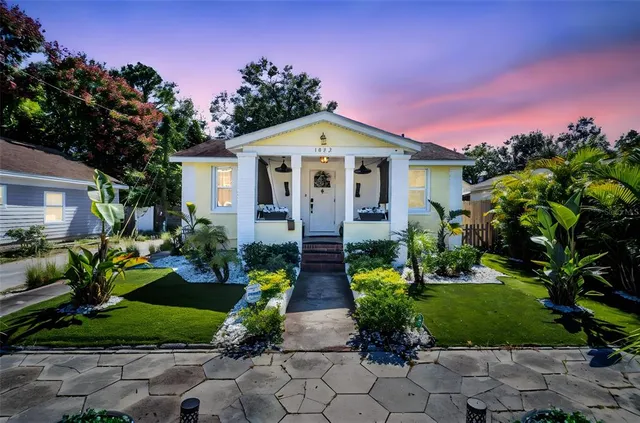 a front view of a house with garden