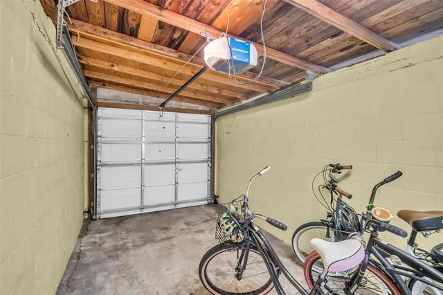 a view of a room with table and chairs
