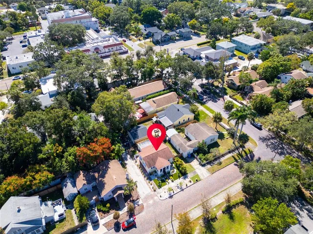an aerial view of residential houses with outdoor space and parking space