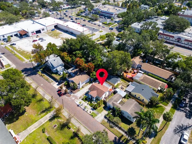 an aerial view of house with yard