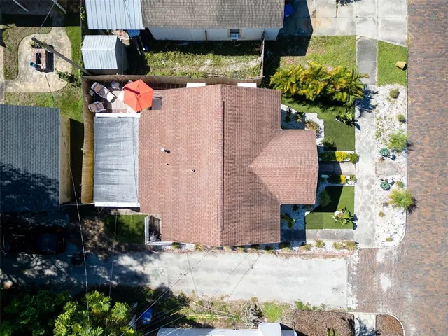 a aerial view of a house with a yard and garden