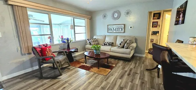 a living room with furniture and a window