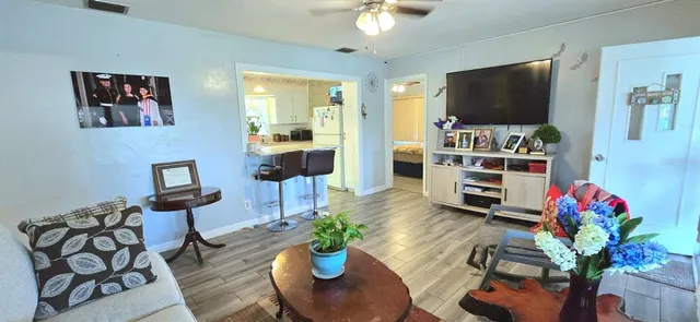 a living room with furniture and a flat screen tv