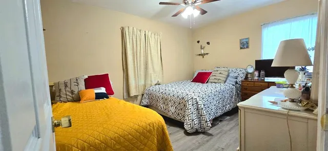 a bedroom with a bed and a lamp