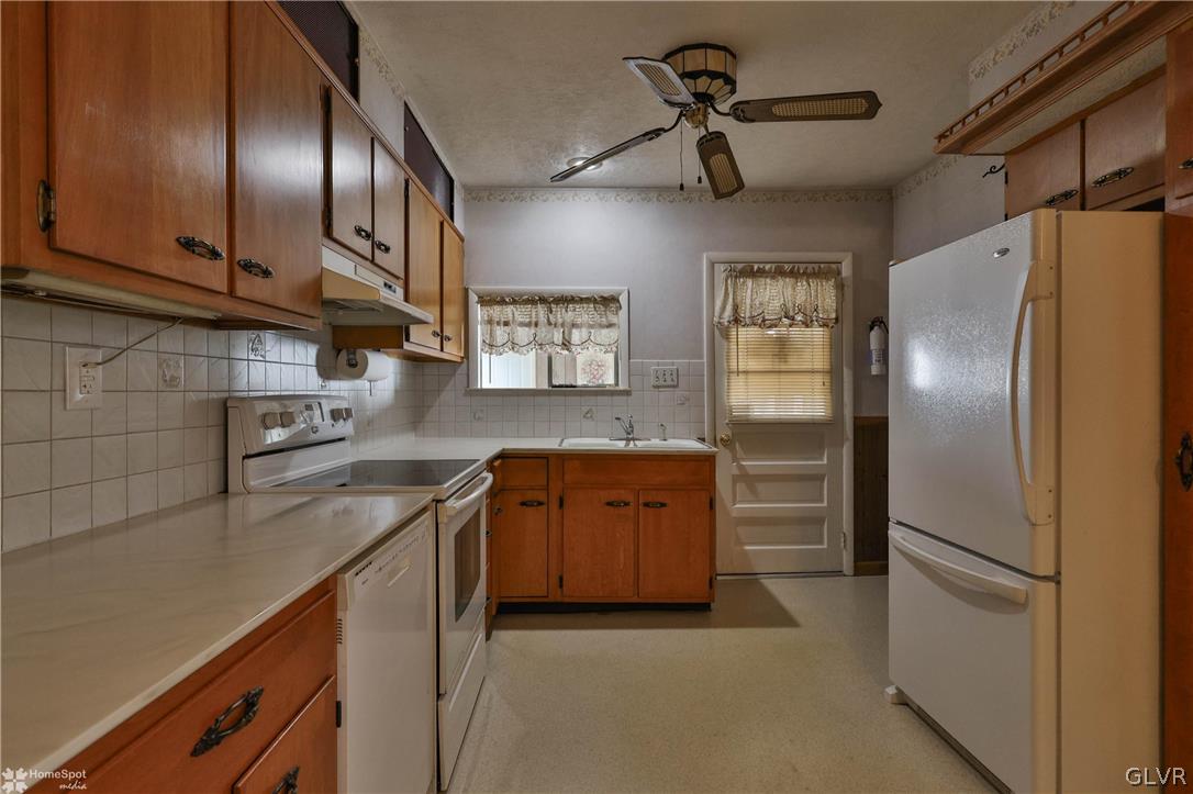 1215 Macada Road Bethlehem, PA 18017 - Photo 21 of 39 a kitchen with stainless steel appliances granite countertop a refrigerator a sink and dishwasher