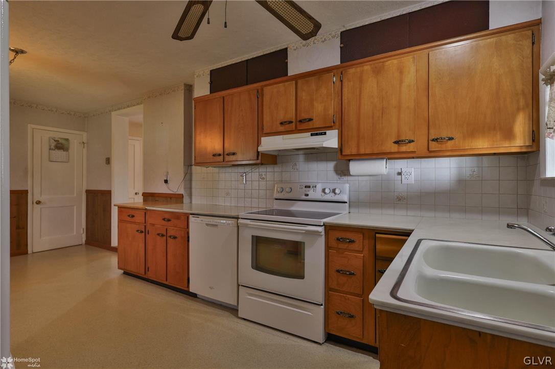 1215 Macada Road Bethlehem, PA 18017 - Photo 22 of 39 a kitchen with stainless steel appliances granite countertop a sink a stove and a refrigerator