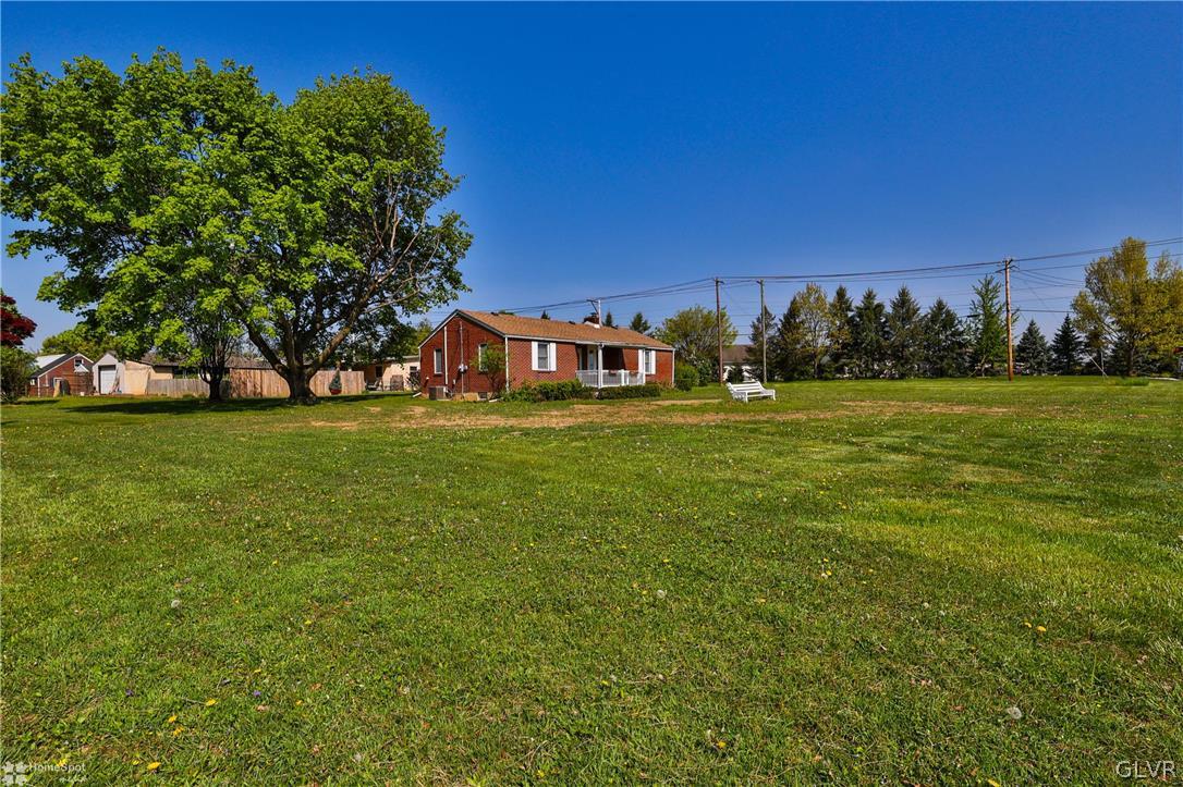 1215 Macada Road Bethlehem, PA 18017 - Photo 3 of 39 a view of a field with an trees