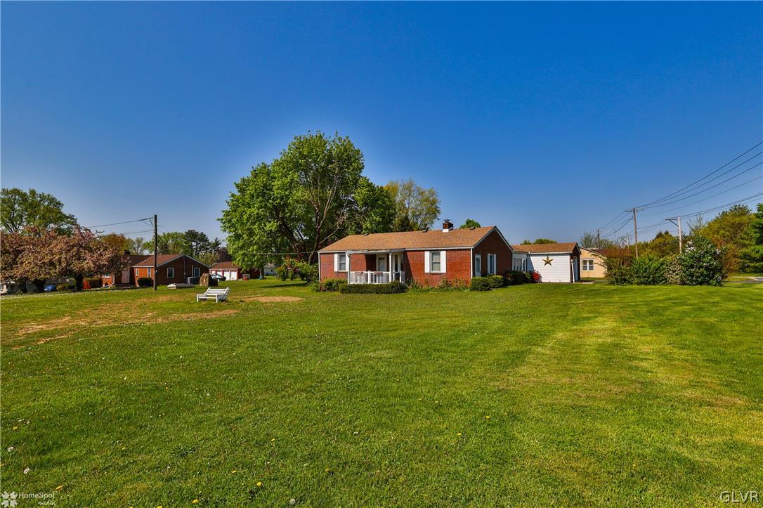 1215 Macada Road Bethlehem, PA 18017 - Photo 4 of 39 a front view of a house with garden
